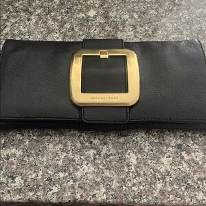 Elegant Black Clutch with Gold Buckle by Michael Kors